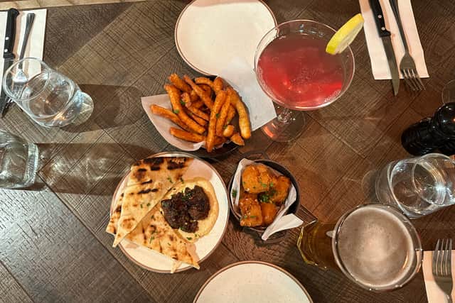 Our three small plates – the halloumi fries, pulled beef hummus flatbread, and mac and cheese bites went down a treat. As did the Cosmopolitan cocktail and the pint of Asahi.