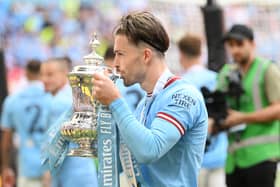 Jack Grealish pictured with the FA Cup trophy after a victory over Manchester United at Wembley. (Photo - Getty Images)