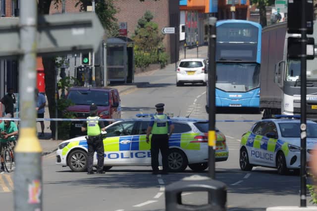 Police investigate a crash on Kings Heath High Street in Birmingham after a woman and boy were struck by a car