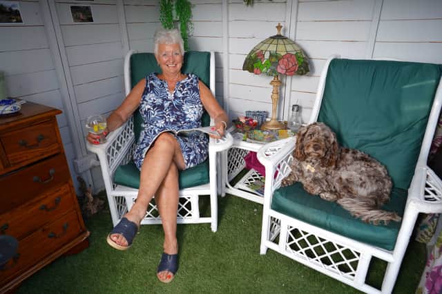Karen now enjoys evenings in the summerhouse with her Cockapoo, Marley.