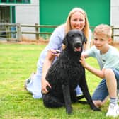 Vicki Hayes with her son, Reuben, and Curly Coated Retriever, Anise, winner of Best of Breed at the first ever Vulnerable Native Breed Show. (Photo - Heidi Hudson/The Kennel Club)
