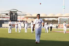 Rehan Ahmed of England walks off, after becoming the youngest debutant in men's Test history to take a five-for during day three of the Third Test between Pakistan and England at Karachi National Stadium on December 19, 2022 in Karachi, Pakistan. (Photo by Matthew Lewis/Getty Images)