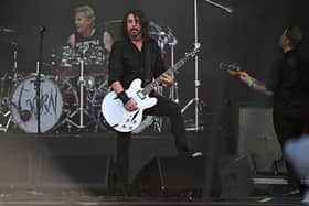 Foo Fighters' Dave Grohl (C), Josh Freese (C), Nate Lendel, performing as The Churnups, play on the Pyramid Stage on day 3 of the Glastonbury festival in the village of Pilton in Somerset, southwest England, on June 23, 2023. The festival takes place from June 21 to June 26. (Photo by Oli SCARFF / AFP) (Photo by OLI SCARFF/AFP via Getty Images)