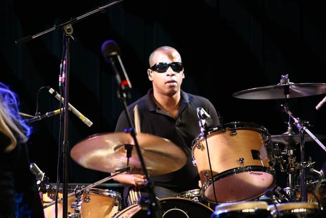 Starting as a session drummer of Duran Duran, Sterling Campbell soon became a full-time band member. Not long afterward, he left the band in early 1991 to work with Soul Asylum, working on the tracks like “Runaway Train,” which won a Grammy Award. From 1995 to 1998, Campbell was a fully-fledged member of  Soul Asylum. Additionally, in 1991, he started to play drums for David Bowie, joining his band in 1992 and working with the legendary singer for around fourteen years until 2004. Over the years, the artist has worked alongside iconic musicians like The B-52s, Cyndi Lauper, Gustavo Cerati, etc. He is still active as a drummer and is a human rights advocate, especially championing the cause of Falun Gong practitioners in China.