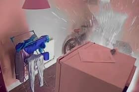 Sparks fly from an e-bike after the battery explodes during a charge inside the owners home in Birmingham