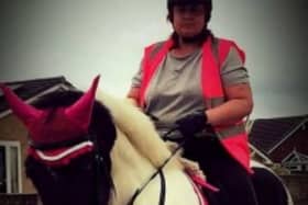 Michelle Hanney pictured riding a horse. (DWP/SWNS)