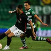 Martinez wins back possession from Sporting Lisbon midfielder Pedro Goncalves during the Europa League round of 32 clash in Lisbon.
