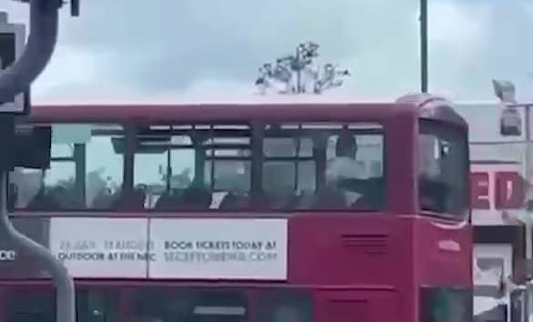 Video grab as a couple left onlookers stunned after they were filmed appearing to have sex on the top deck of a bus in Birmingham