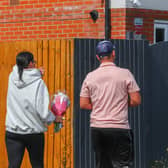 People leave tributes to a seven year-old girl who died in a hti and run at Turnstone Road, Bloxwich, Walsall, West Midlands