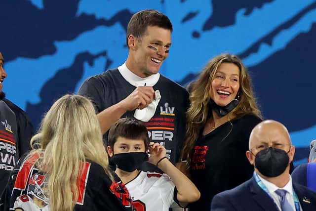 Tom Brady #12 of the Tampa Bay Buccaneers celebrates with Gisele Bundchen after winning Super Bowl LV at Raymond James Stadium on February 07, 2021 in Tampa, Florida. (Photo by Kevin C. Cox/Getty Images)