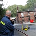 Fire crews at The Crooked House pub in the village of Himley, Dudley. (Photo - Anita Maric / SWNS)