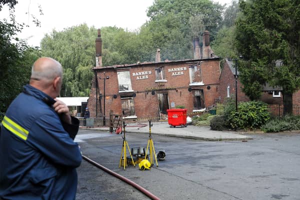 Fire crews at The Crooked House pub in the village of Himley, Dudley. (Photo - Anita Maric / SWNS)