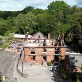 The burnt out remains of The Crooked House pub near Dudley before it was demolished 
