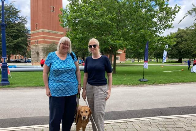 Clare Williams and Louise Connop, Birmingham Sight Loss Council, with guide dog Quita at the University of Birmingham. Credit: LDRS.