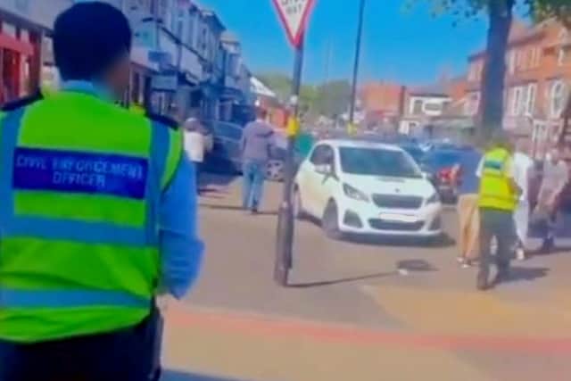 Shocking moment traffic wardens are attacked in Birmingham