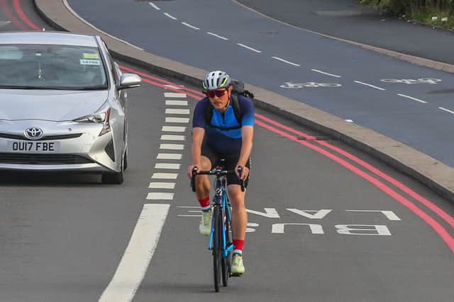 A cyclist using the road and bus lane whilst ignoring the cycling lane on the A34 in Birmingham on September 6, 2023. (Photo - Joseph Walshe / SWNS)