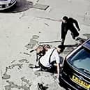 CCTV footage of the dog attacking members of the public on a garage forecourt, in Bordelsy Green, Birmingham