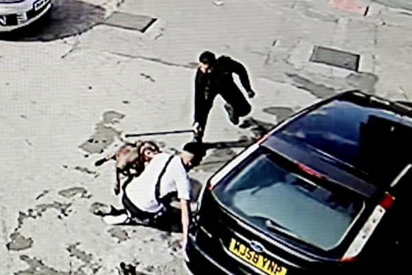 CCTV footage of the dog attacking members of the public on a garage forecourt, in Bordelsy Green, Birmingham