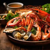 A platter of fresh seafood including lobster crab and shrimp