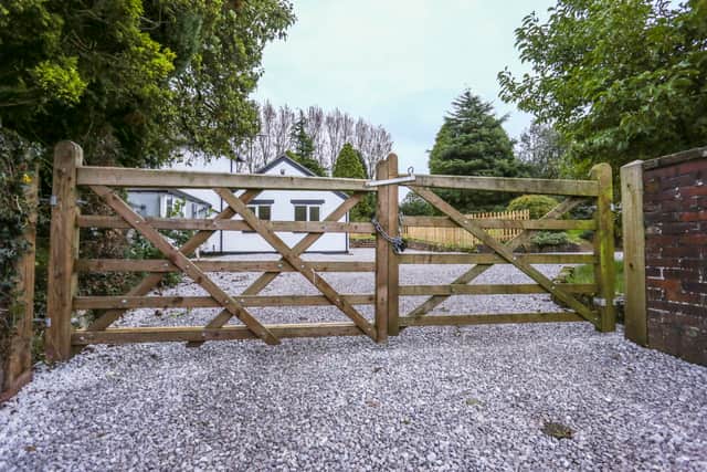 Empty houses sit behind padlocked gates on Heath Road in Whitmore Heath, Staffordshire, where 70% of the homes were purchased for the HS2 project, October 6 2023.