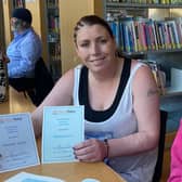 Hannah Joyce with her reading coach, Chelsey, after receiving certificates for completing the first two Read Easy modules