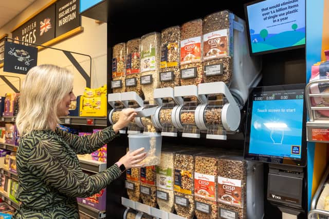 Member of the Refill Coalition using new refill system  in the Solihull store