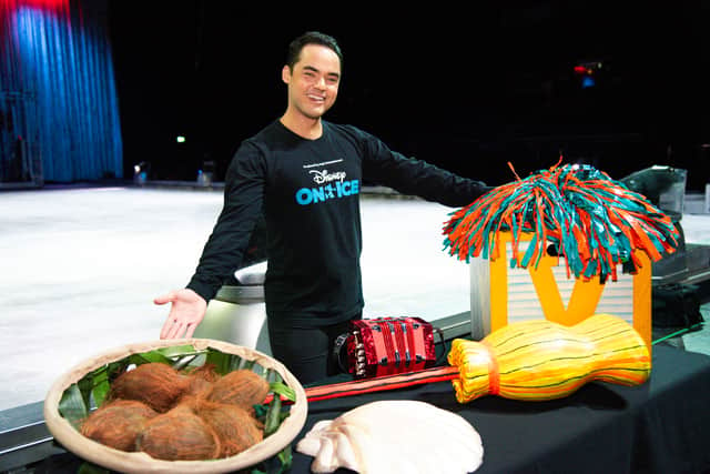 Alejandro Garcia stands next to some of the show props. (Nicola Gotts Photography)