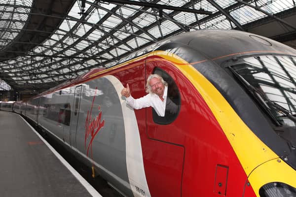 Sir Richard Branson promotes Virgin Trains at Liverpool Lime Street Station. Image: Tony Woolliscroft/Getty Images