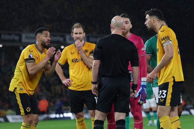 Wolves players protest a VAR call against Newcastle United (Image: Getty Images)