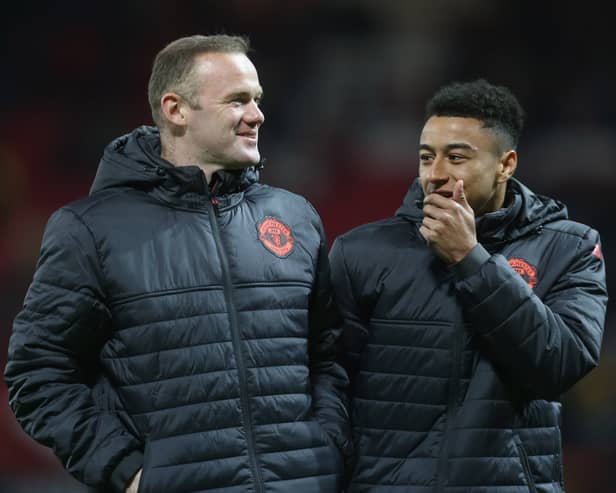 Wayne Rooney and Jesse Lingard played together at Manchester United. Lingard is without a club since leaving Nottingham Forest. (Photo by John Peters/Manchester United via Getty Images)