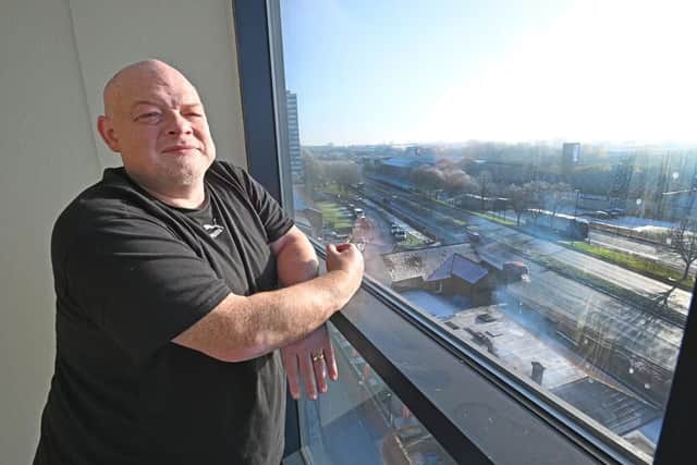 Jake Russell looking down on the street race track from his Kenrick estate flat in West Bromwich