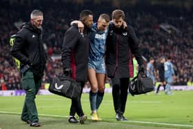 Aston Villa will be without Lucas Digne for a few weeks. He was helped off in the 3-2 defeat to Manchester United.(Image: Getty Images)