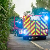 A pair of english fire engines parked at the side of the road (stock image)