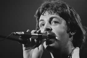 Paul McCartney performs with the Wings in 1976