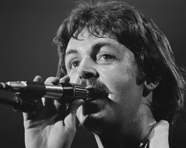 Paul McCartney performs with the Wings in 1976
