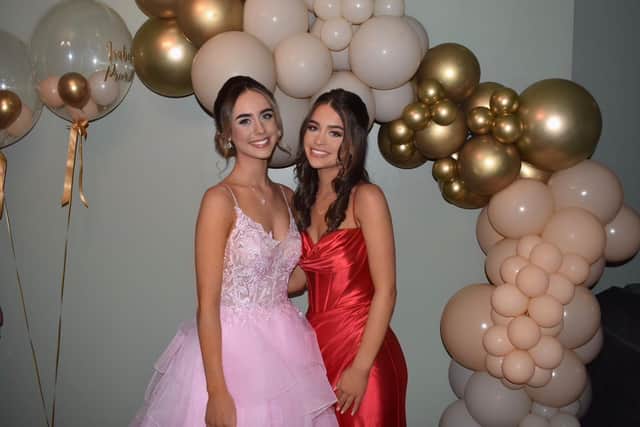 Non identical twins Catherine(right) and Isoballe Croke, aged 17, from St Peter's School in their prom dresses from last year. They both work part-time at the shop