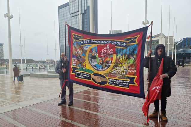 Lee Wiggetts-Clinton from Unite the Union with a banner for the march (credit: Birmingham World) 