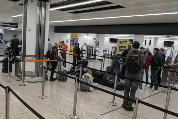 Anxious passengers queue at Birmingham airport