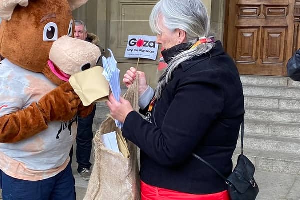 Protesters hand sackful of letters to Birmingham City Council to protest against youth services cuts