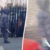 moment a hooded knifeman casually walked down the street while brandishing a huge blade near a Birmingham primary school