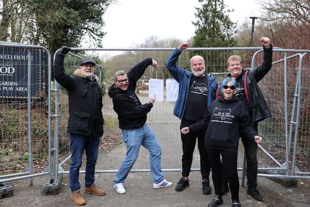 Campaigners for The Crooked House pub in Himley, near Dudley celebrate the rebuild orer at the ruins of the demolished pub