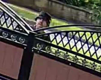 One of the two men that police are hunting in connection with an arson at a property on Scott Hall Road, Leeds