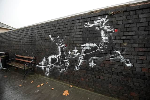 Banksy’s mural, located at Jewellery Quarter, features two large reindeer pulling a bench behind them. The artwork raises awareness about homelessness. Tourists often sit on the “Banksy Bench” to appreciate the piece. 