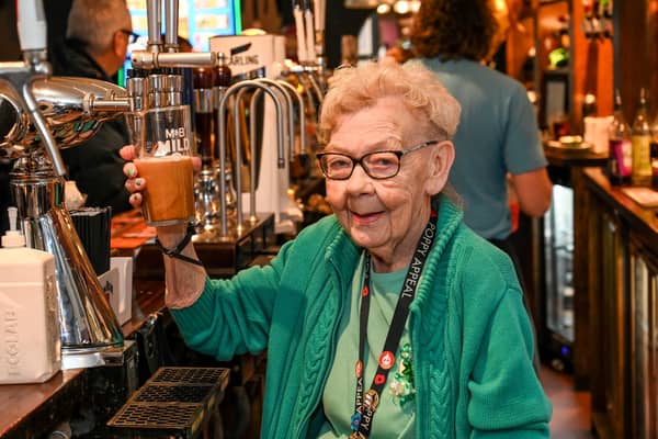 Ann Wilson, 82, marks 50 years of pulling pints in Birmingham and is thought to be one of the oldest barmaids in Britain