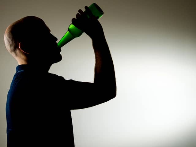 A man drinking alcohol - picture posed by model