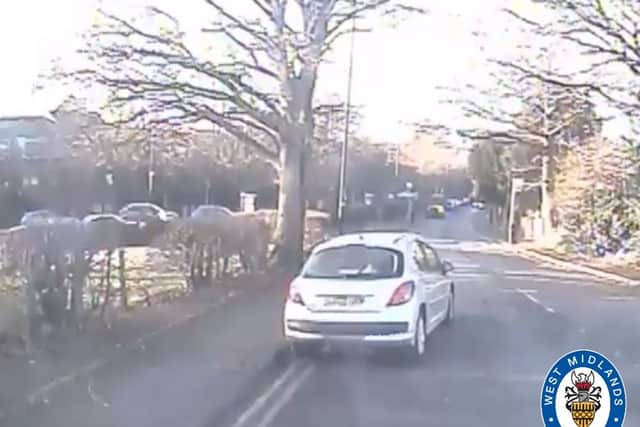 West Midlands Police seek driver of white car pictured on Hill Hook Road in Sutton Coldfield after woman found injured