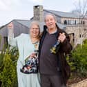 Omaze Million Pound House Draw Cornwall winner Rose Doyle with husband Tony outside their new home