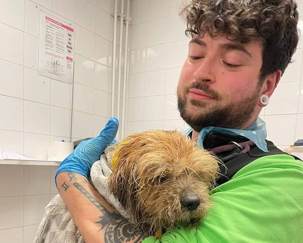 Staff at Birmingham Dogs Home in Wolverhampton with rescued pooch Oliver after his rescue wash