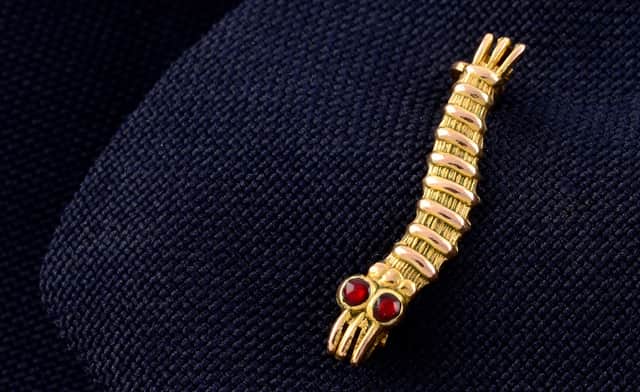 2cm gold Caterpillar Club pin, awarded to Sgt Bernard John Warren of the RAF 103 Squadron, has sold for more than £1K at auction