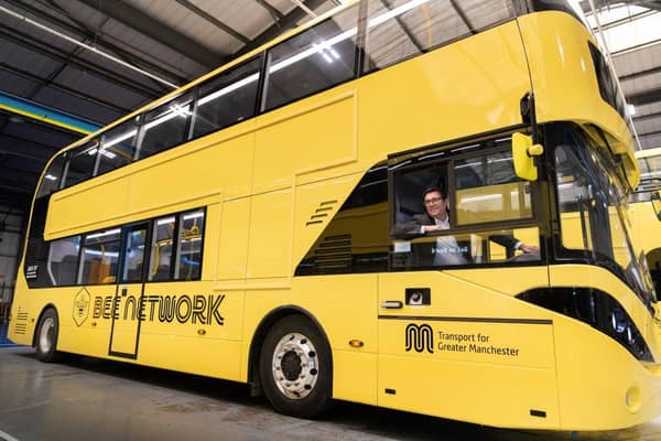Andy Burnham inside a yellow Bee Network bus. In total, it cost £500k to turn the whole fleet of buses yellow. Credit: TfGM